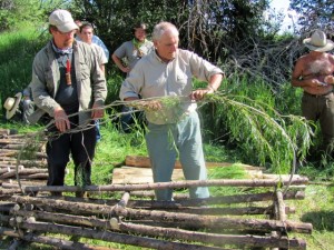 Super Shelter construction with its inventor, Mors Kochanski at Woodsmoke.  Kelly Harlton, Karamat instructor to left has a variation we discuss below.